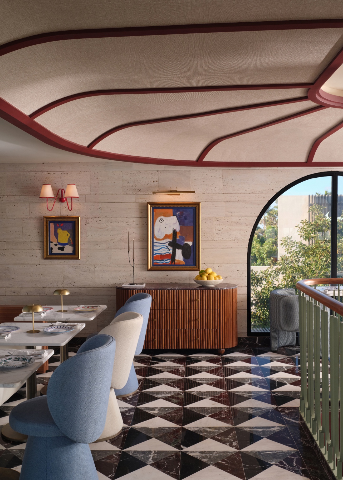 Beyti upper dining room with sculpted plaster ceiling, modernist paintings, and travertine walls