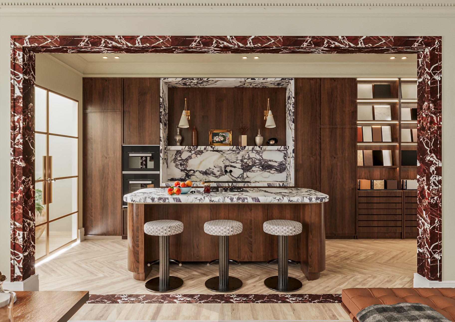 Walnut kitchen framed in rosso marble with a sculpted stone island and upholstered stools